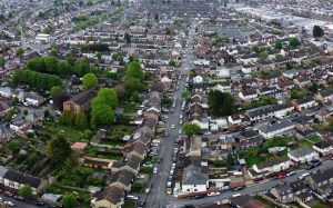 A drone-captured aerial view of the residential neighborhood in Luton, England, showcasing urban and landscape balance.